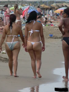 Bunch of sexy babes at the beach in thong bikinis