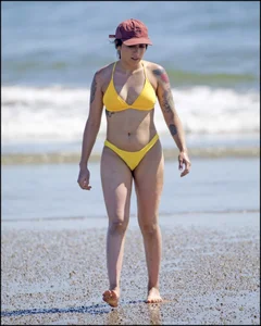 Sexy tattooed beach brunette with a great ass in yellow thong bikini