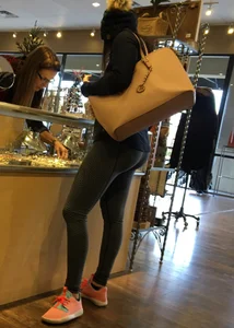 Brunette jewelry shopping in leggings with a nice ass