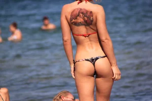 A couple sexy girls laying out on the beach