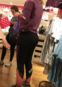 Pink employee with a perfectly round ass in leggings