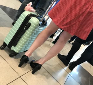 Nice skinny girl with skinny legs wearing a dress and high heels airport creepshot