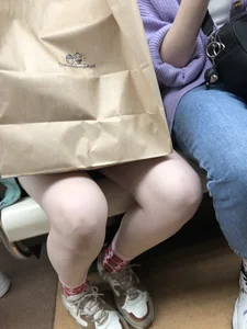Cute Teen Girl in a Skirt And Sneakers With Very Pale Skin, Candid Photos in Subway