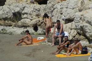 Girls on a nude beach in Sitges, Spain