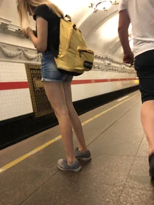 Cute Skinny Teen in Jean Mini Shorts Standing on the Subway Platform