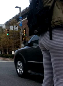 College girl in striped leggings walking with nice ass