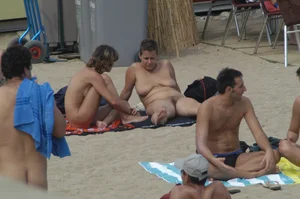 Topless girls on a beach in Barcelona