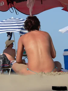 2 topless thonged sexy friends on the beach with great bodies