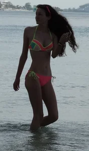 Two candid skinny teen sisters in bikinis