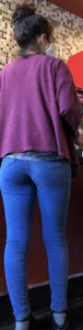 Latina in Nike leggings at the wing shop