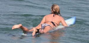 Candid surfer babes on the beach and in bikinis