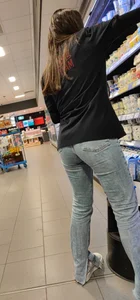 Supermarket clerk stretching a bit