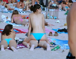 A bunch of sexy beach voyeur babes in bikinis, thongs and topless