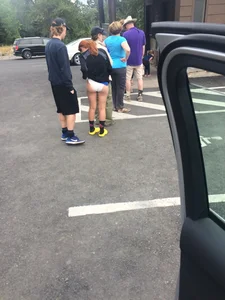 Girl Pulling Up Her Skirt Revealing Panties on the Suburban Street Candid Pic