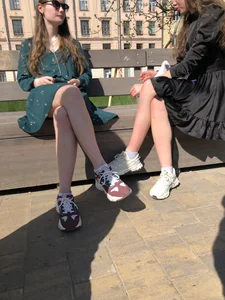 Girls in Dresses Sitting With Crossed Legs on a Park Bench Street Creepshots