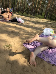 Cute Girl in Swimsuit Standing in Water and Lying on a Beach Gallery