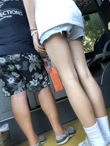 Candid girl's long skinny legs with pale skin getting on the bus creepshot