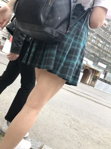 Street candid teen wearing a skirt