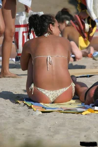 Beach voyeur girls in bikinis, thongs and topless
