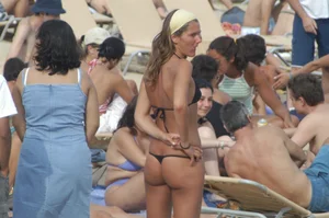 Topless girls on a beach in Barcelona