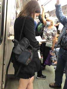 Cute Girl in a Mask With Sexy Legs Reading in a Subway Train Creepshots Gallery