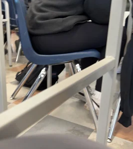 College teen in leggings sitting at her desk in class creepshots
