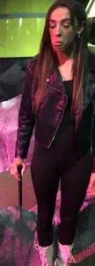 Skinny girl in a leather jacket and leggings playing mini-golf creepshots
