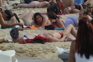Topless girls on a beach in Barcelona