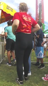 Chubby teen pulling up her leggings in the park