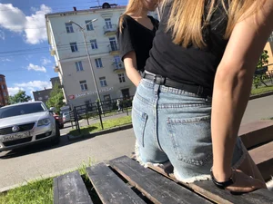 Girl in Denim Shorts with Amazing Hot Legs Fixing Her Sandals Street Candid Photo Gallery