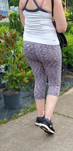 Milf booty in tight leggings shopping for plants