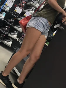 Sexy candid girl in jean mini shorts, great legs closeup creepshot at the store