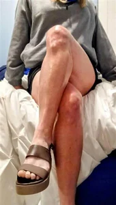 Distracted by smooth sexy legs on bed in apartment.