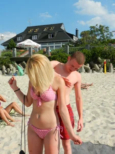 Cute Blonde Girl in a Pink Polka Dot Swimsuit at a Beach Creepshots Series