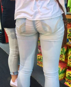 Girl in wet jeans making them semi see through