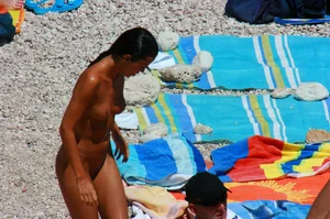 Ula FKK Sexy brunette on a nude beach topless, bottomless and with blue thong