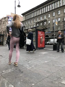Cute skinny blonde candid teen wearing tight pink jeans