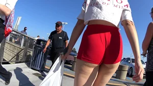 Red short shorts teen cheeks out. walking in mall