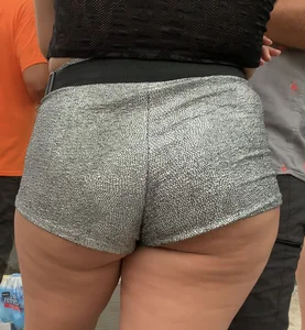 Fat ass showing cheek in shiny gray shorts