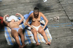 Two teens stripping and going topless to tan