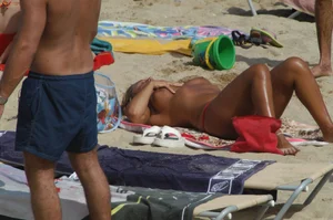 Topless girls on a beach in Barcelona