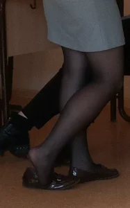 Candid teen shoe dangle in class
