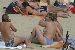 Topless girls on a beach in Barcelona
