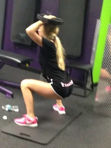 Skinny Girl Doing Squats in Gym Candid
