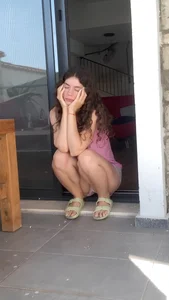Squatting cutie wearing shorts and sandals creepshots