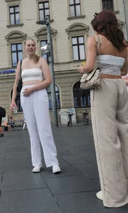 Long blonde braless in a white outfit (many pictures)