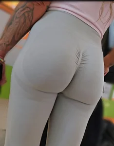 Fit blonde in grey leggings with a Fat Ass