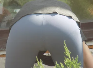 Hot braless milf in tight shorts bend over while working in her garden creepshots