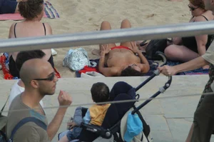 Topless girls on a beach in Barcelona