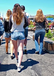 Cute girl walking in short jean shorts
